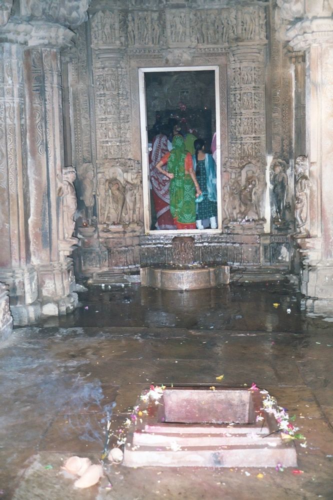 Devotees pass through the mandapa and crowd into the garbhagriya or sanctuary.