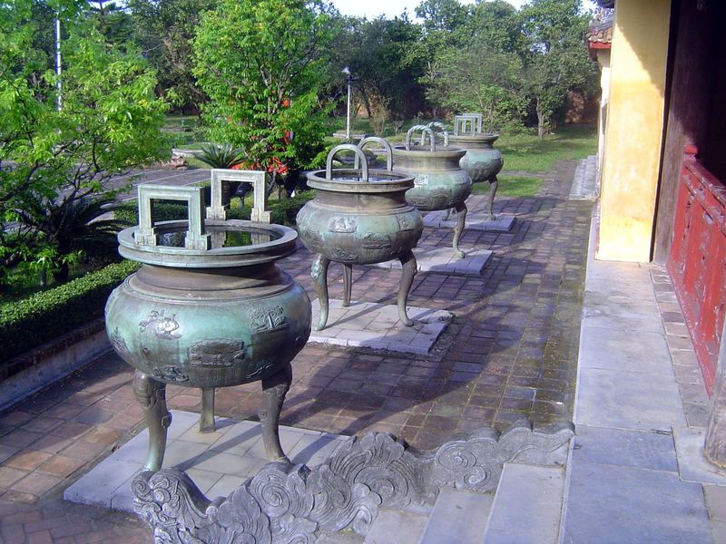 Nine dynastic urns, cast in honor of the Nguyen Dynasty kings. Precious few Vietnamese today can read the Chinese characters, abolished as t