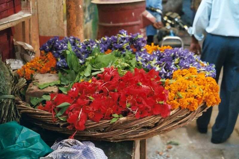 Pushpa, or flowers, are a common temple offering. Here they are offered for sale.