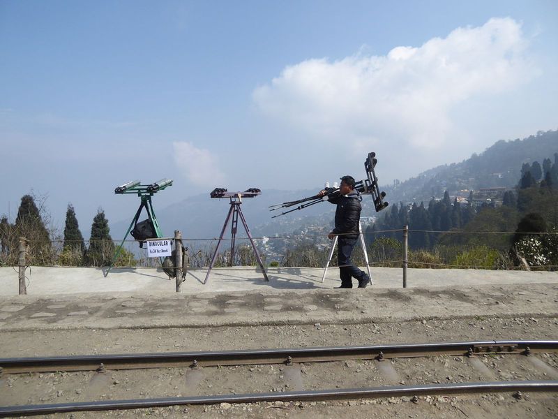 It's mid-morning, but this guy, at Batasia, is packing up and going home. He had hoped to rent binoculars to tourists eager to see the Himal