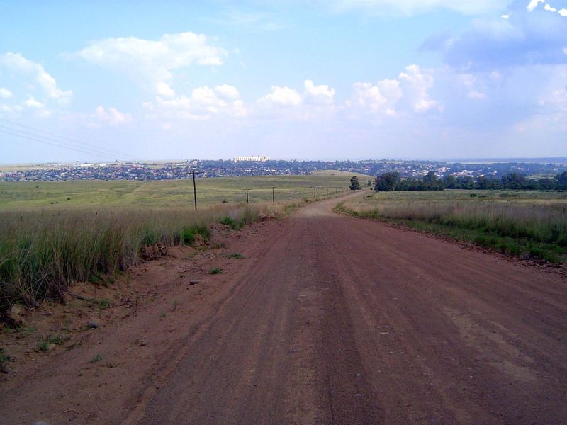 The road drops toward Frankfort, a huge grain elevator in the distance.