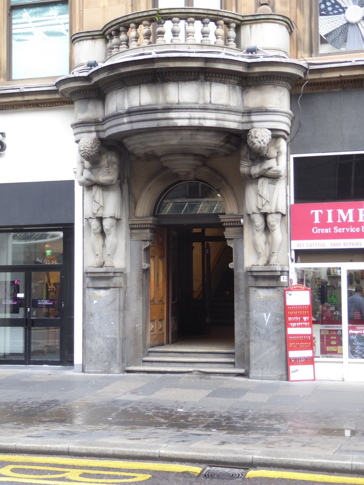 Speaking of ponderous, what did William Vickers have in mind when he, the sculptor, put these Atlantes at the doorway? Cruel and unusual pun