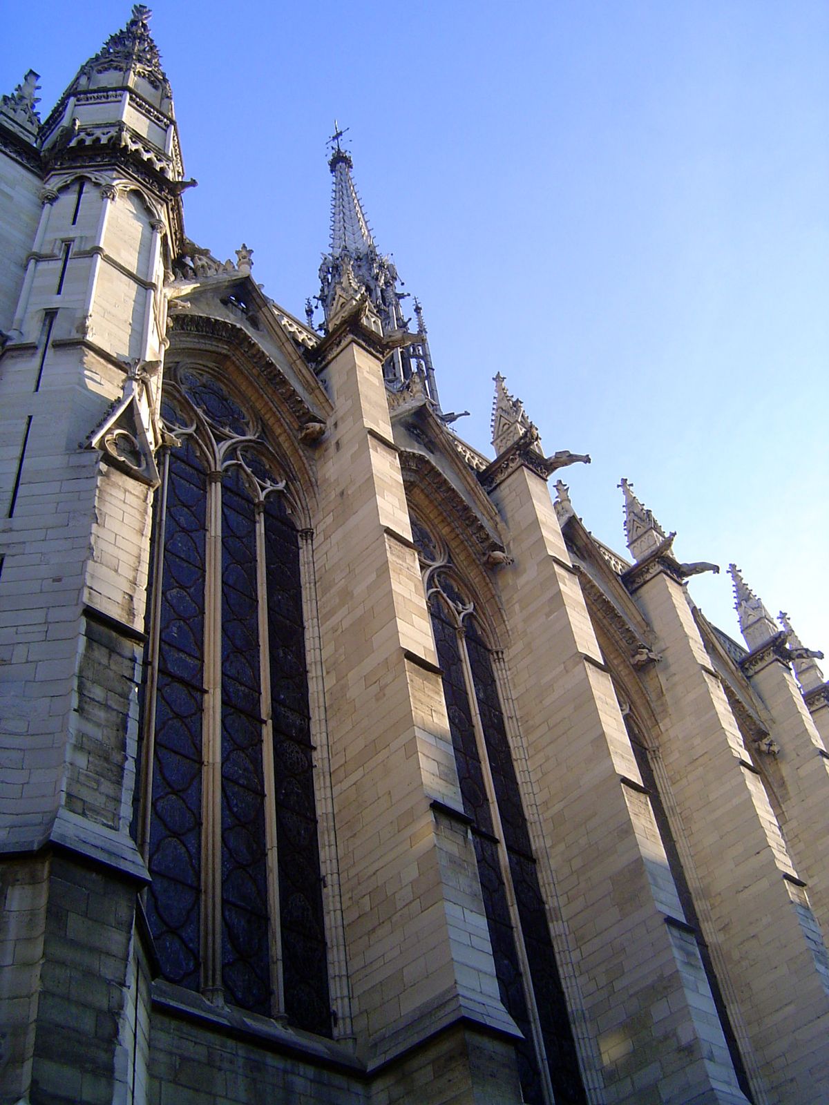 Visitors rarely wonder how this stone building resists the thrust of the roof with such modest buttressing. The answer is iron rods lacing t