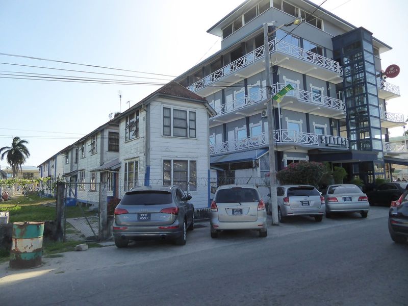 A row of social or public housing survives next to the Status International Hotel.