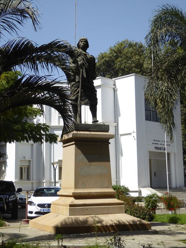 Another Senegalese rifleman or tirailleur sits outside the Primature or prime minister's office and faces the presidential palace. Photograp