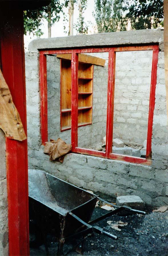 The traditional buildings are mortared stone. Concrete blocks are less picturesque, but they take a lot less mortar and don't have to be car