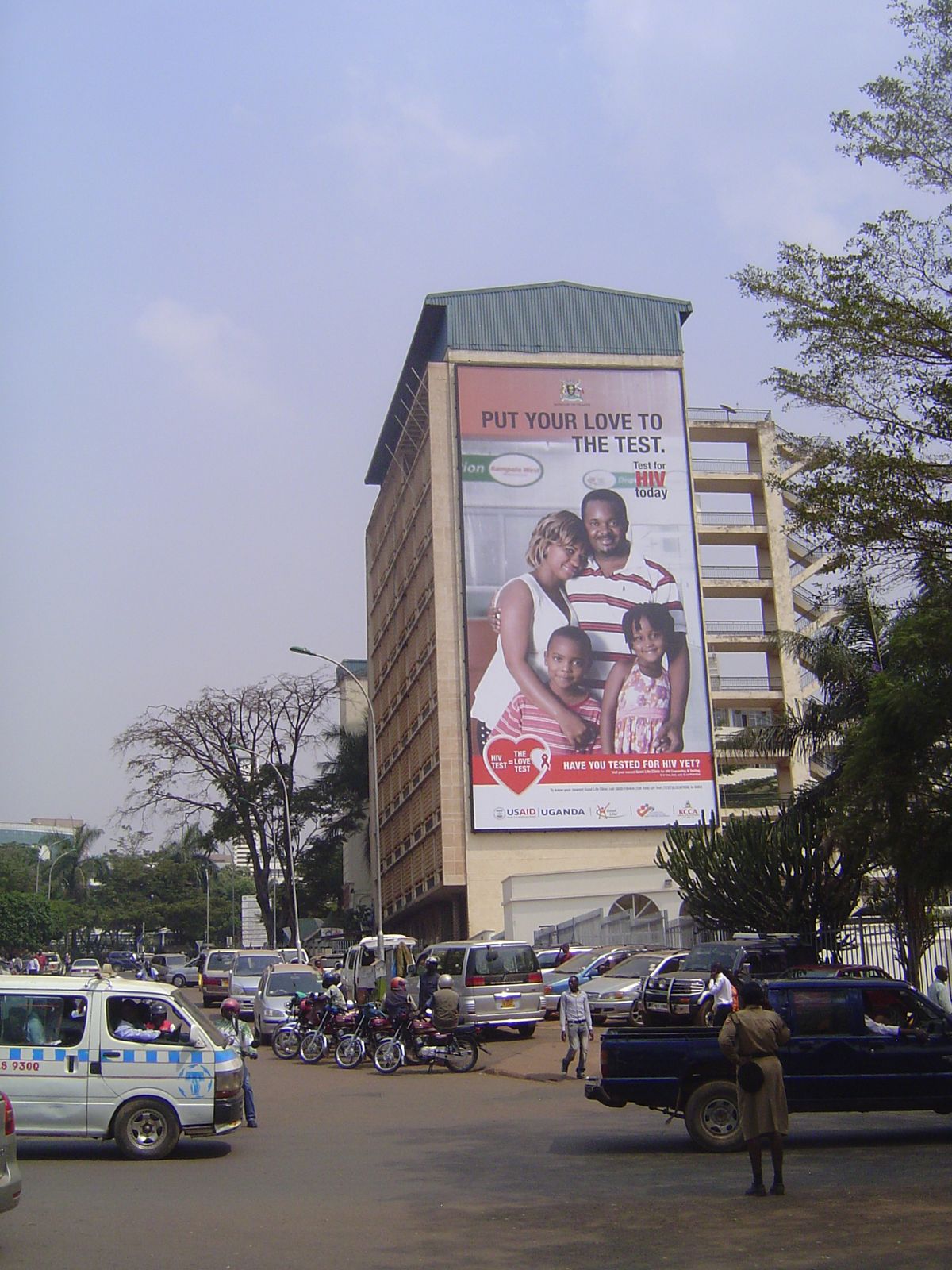Blank walls become billboards plastered ubiquitously with U.S.-funded signs urging HIV testing. Why is that USAID, like other development ag
