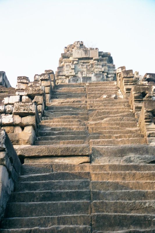 Not far beyond the bridge is Ta Keo, built about 1000 as the state temple of Jayavarman V. That makes it older than Angkor Wat, the Bayon, o