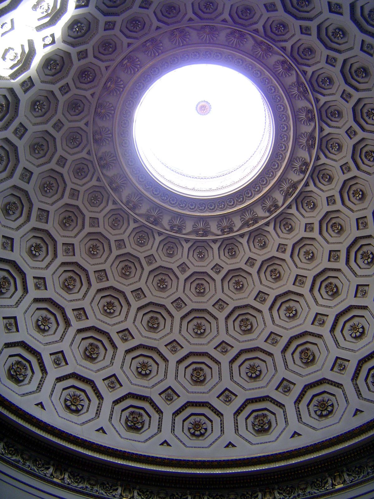 The dome and oculus of the rotunda. Pevsner writes of the room that "the spatial effect of moving from the hall into the rotunda is delightf