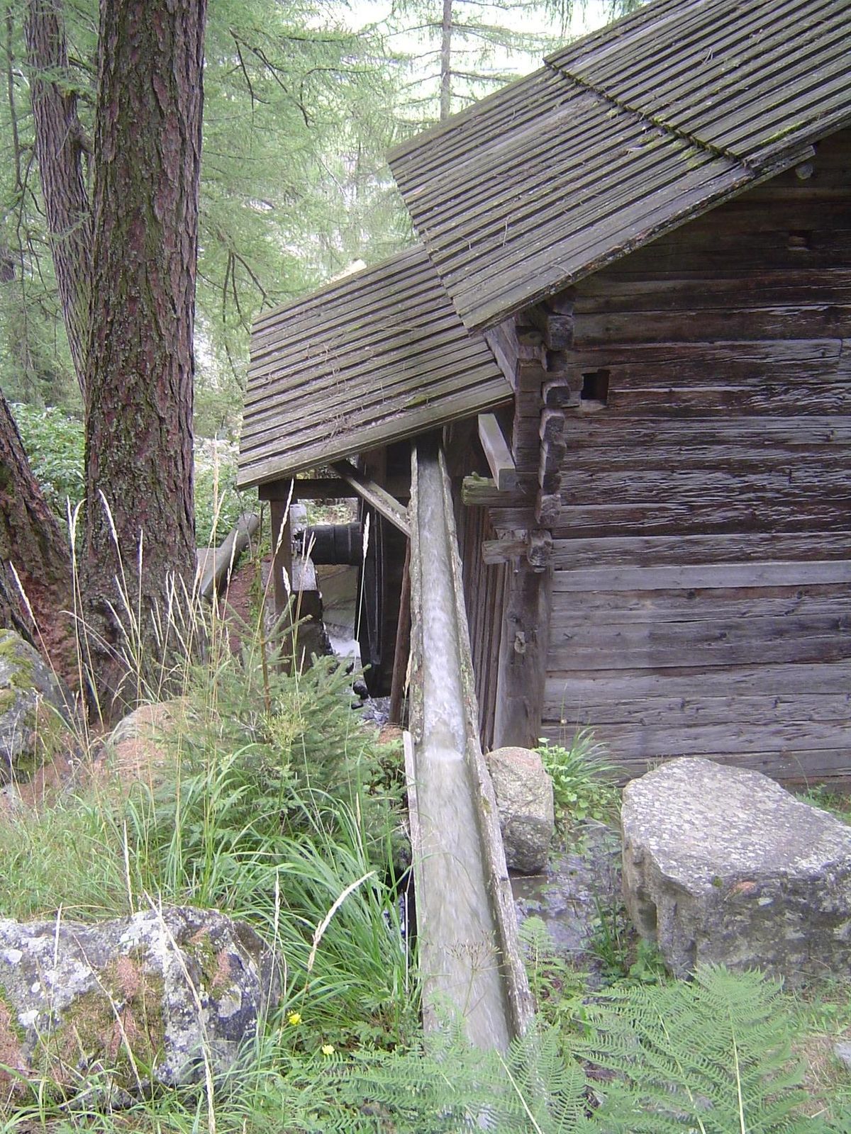 Water running toward an overshot wheel.