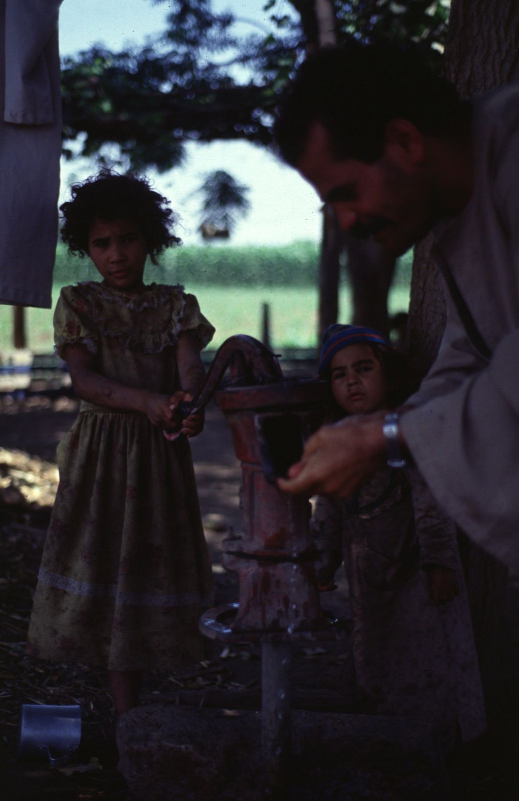 A moment before the previous picture was taken, the girl's father washed her face so she'd look her best.