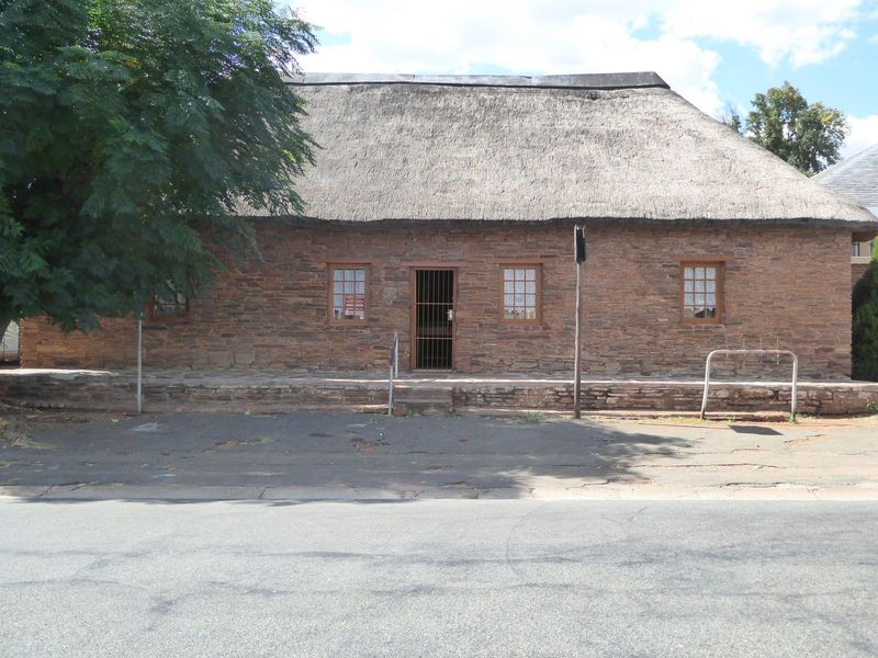 Facing it is the London Missionary Society's station from 1805. A Dr. and Mrs. Moffat lived here: the link to us is that their daughter Mary