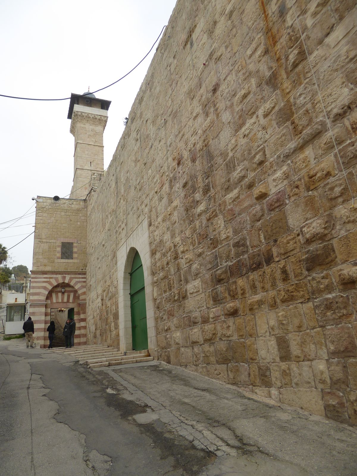 The entrance to the mosque inside the enclosure is through these steps that hug the wall.