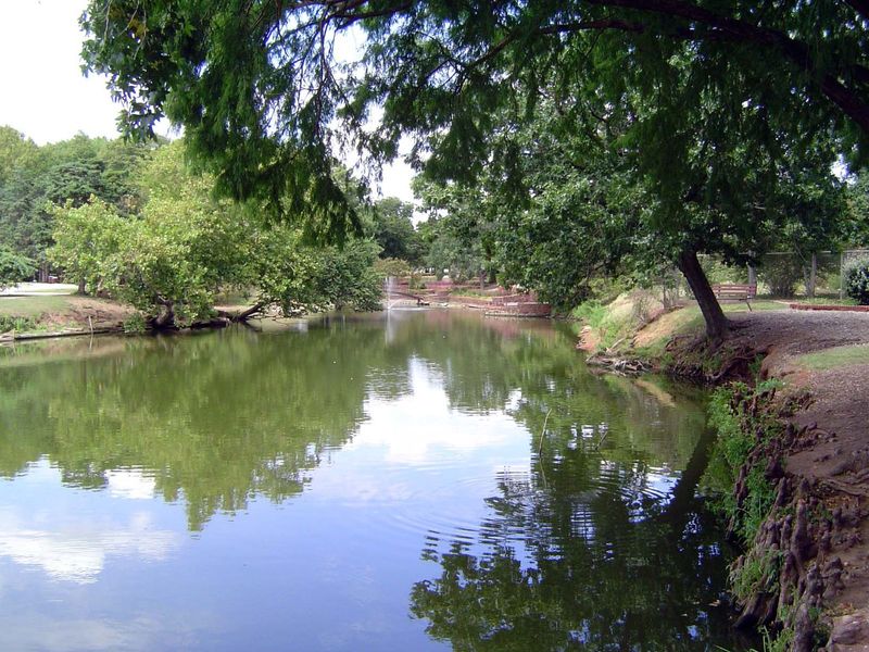 A pond in the park, presumably from the 1930s.