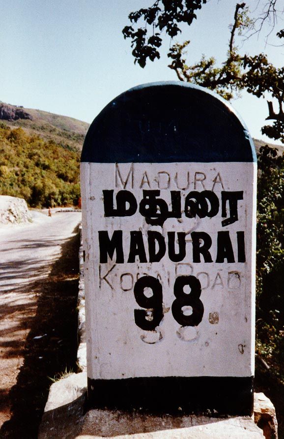 A British roadsign, corrected from miles to kilometers.