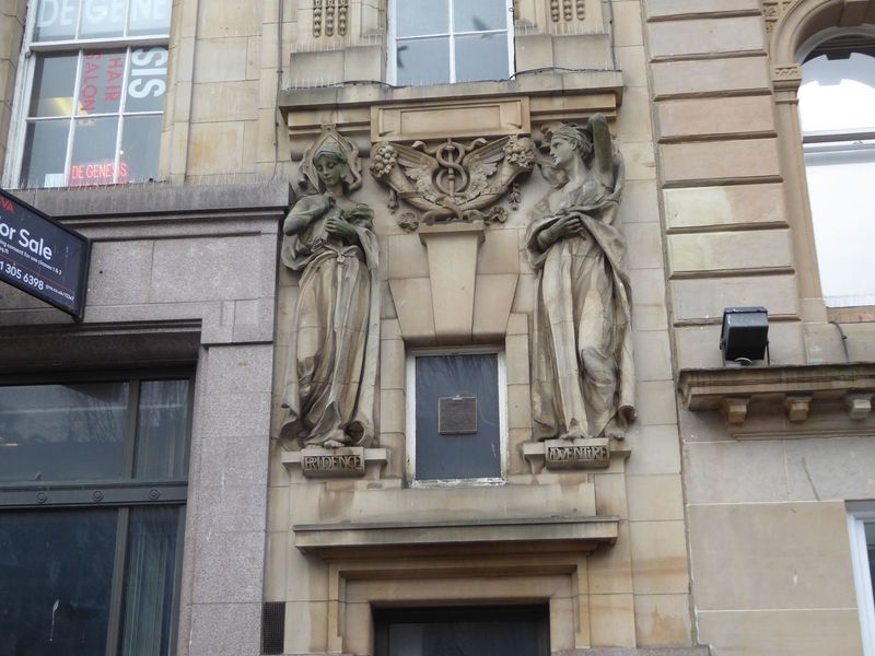 Four figures were designed by Phyllis Archibald for the building. Yes, a female sculptor. These two are labelled Prudence and Adventure, and