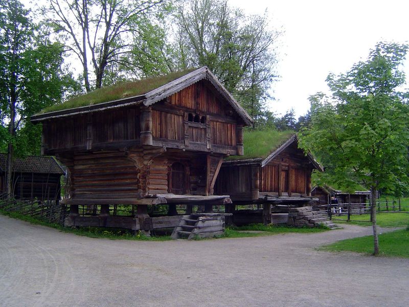 Old when that milepost was young: a loft from about 1300, judged by the round logs, notches, and runic inscription. There was a bedroom upst