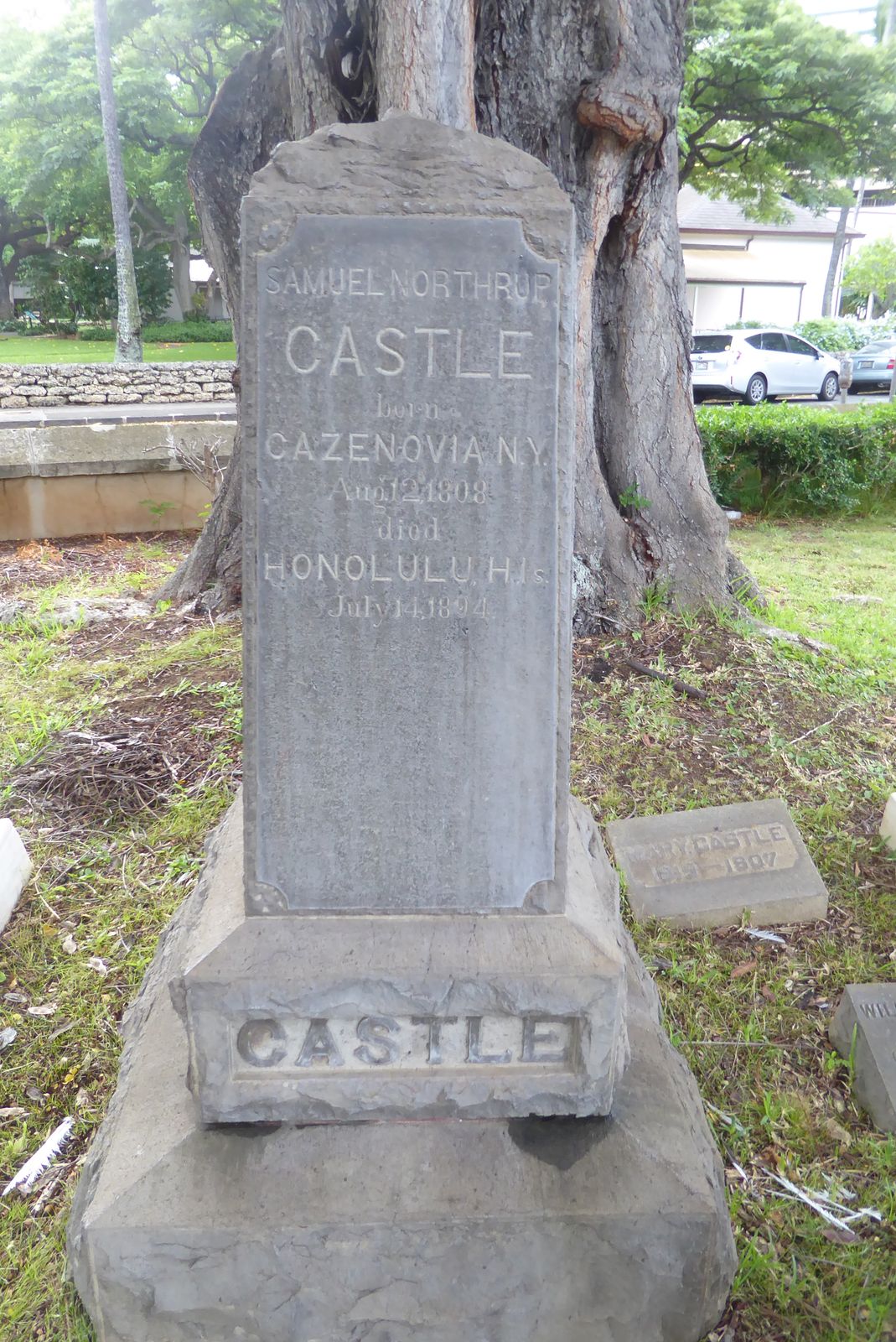 A nearby stone marks the grave of one of the founders of Castle and Cooke, a firm which grew to control Dole Food.