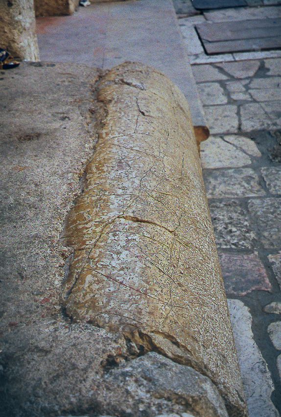 Relics everywhere: a Roman column serves as a bench in the courtyard outside the main entrance of the church.