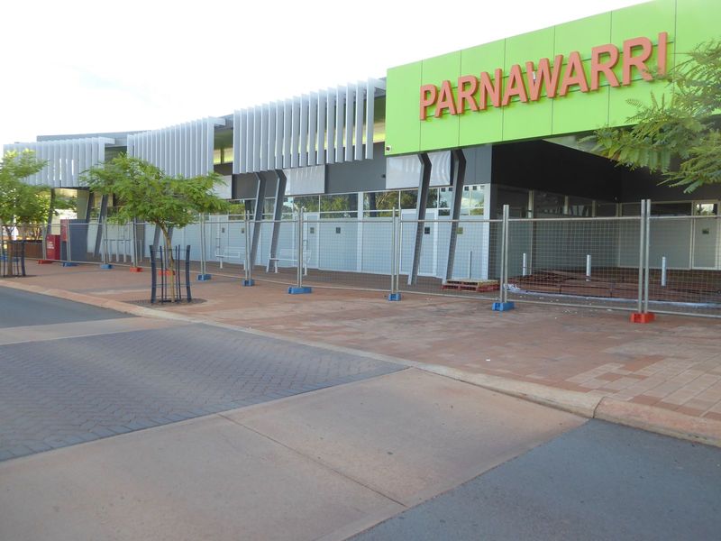 The Woolworths has just been spruced up because the town's about to get a new shopping center. Whether the town can support two is a nice qu