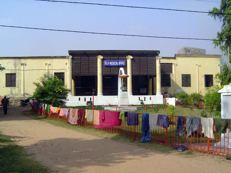 The sign says "Old Medical Ward," but the building has a much longer history than that. It sits on the site of the Lalbagh Palace and was oc