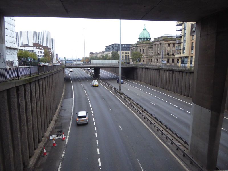 If the river forms the southern boundary of the city's core, the western boundary must be this, the M8, a motorway completed in 1972 and pri