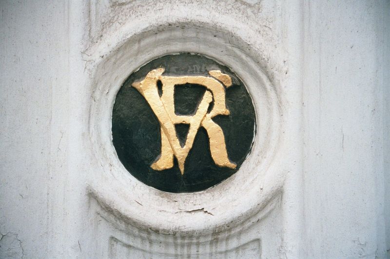 Not explicit enough? How about this: Victoria Regina, on the gate of the British Embassy.