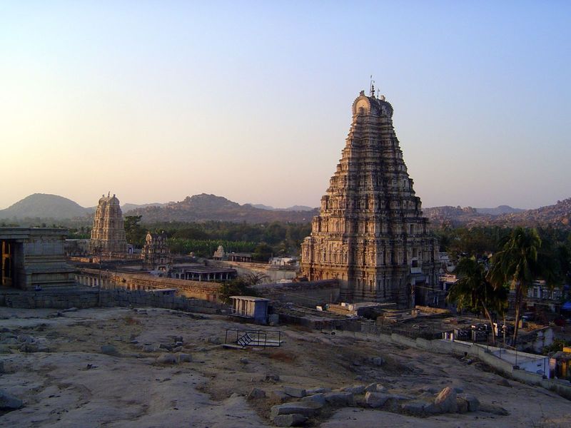 A fuller view of the temple including the second gopura and the north one. The building at the left once had a stepped roof, suggesting inco