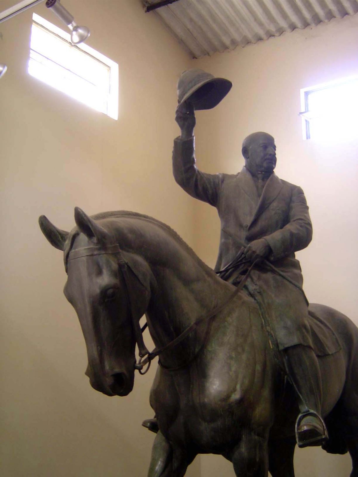 Sir Harcourt waves to nobody.