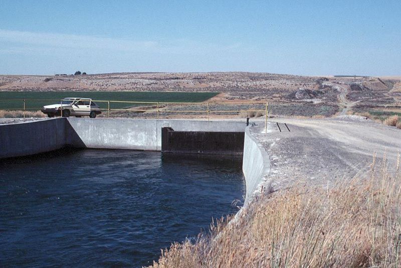 The east branch enters a siphon, shown here, with the far end visible in the background. The fine rental car helps date the picture.