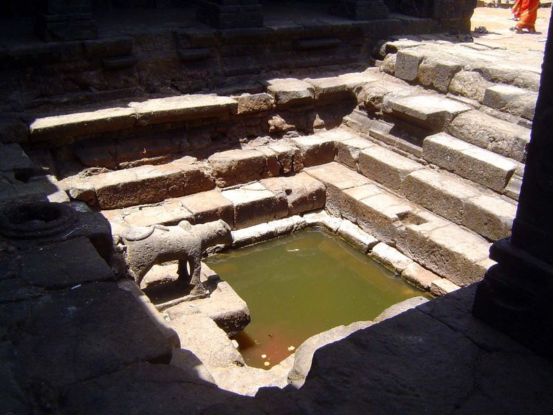 In front of the shrine there's a pond that in the wet season spills over the lip.