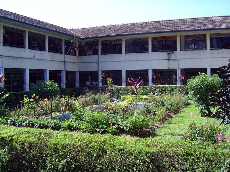 The market stalls wrap around a surprisingly well-cared-for patio garden.