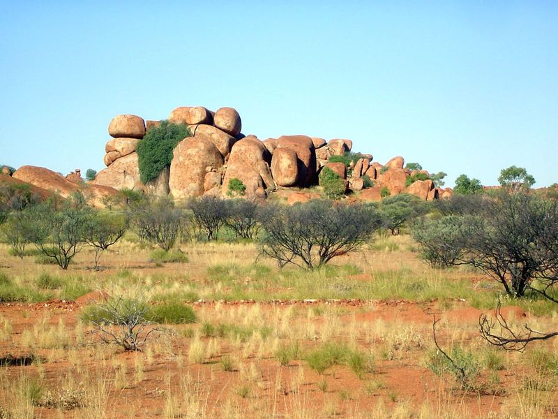 A little geological diversion: they're the exfoliation blocks called the Devil's Marbles.