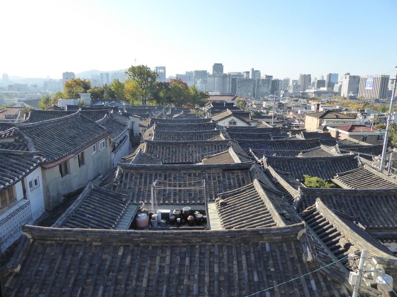 We've climbed up to the rooftop of an enterprising property owner who's created his own for-profit hanok observatory. We're looking south to