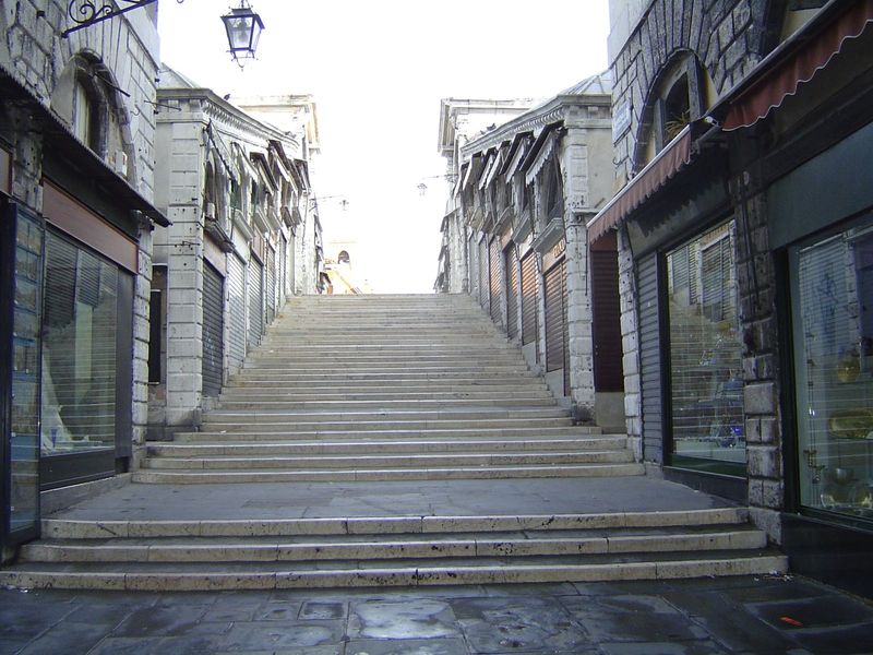 Like Florence's old bridge across the Arno, this one is lined with shop space, in this case rented out since 1591. Steps obscure the arch be
