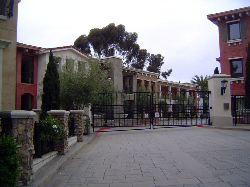 Across the street, a different option: a gated community swept clean of trash and riffraff.