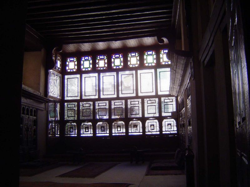 Elaborate mashrabiya, a wood screen that gives privacy and reduces the painfully bright light.