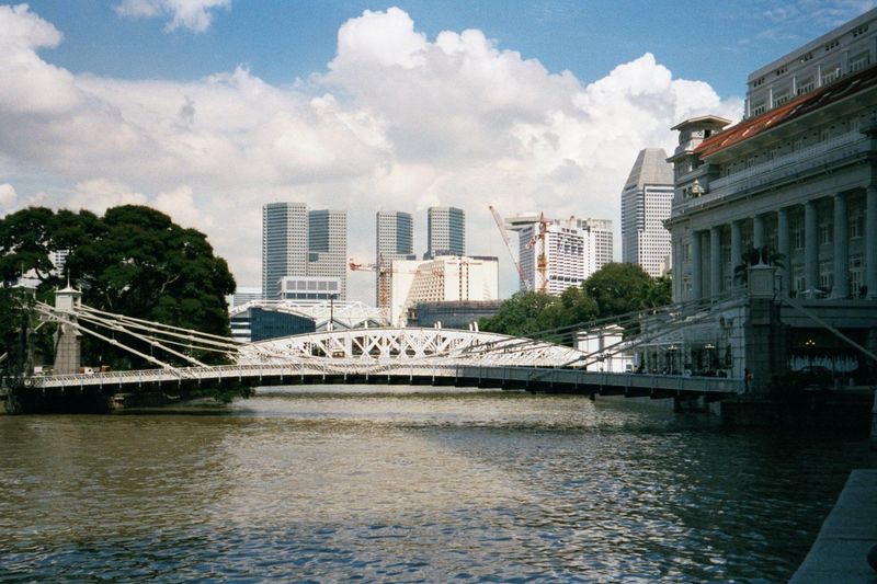 Marina towers rising beyond the Cavenagh Bridge. On the right, the old post office, now the Fullerton Hotel.