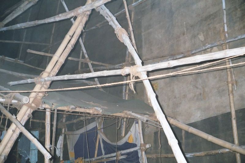 Behind the scenes: bamboo and cloth, plus plywood flooring. It all comes down the next day.