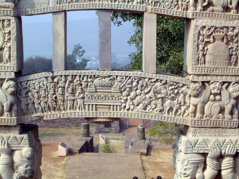 The bottom architrave according to Marshall and Fouchet shows a procession to the Bodhi tree; later interpreters see the moment of enlighten