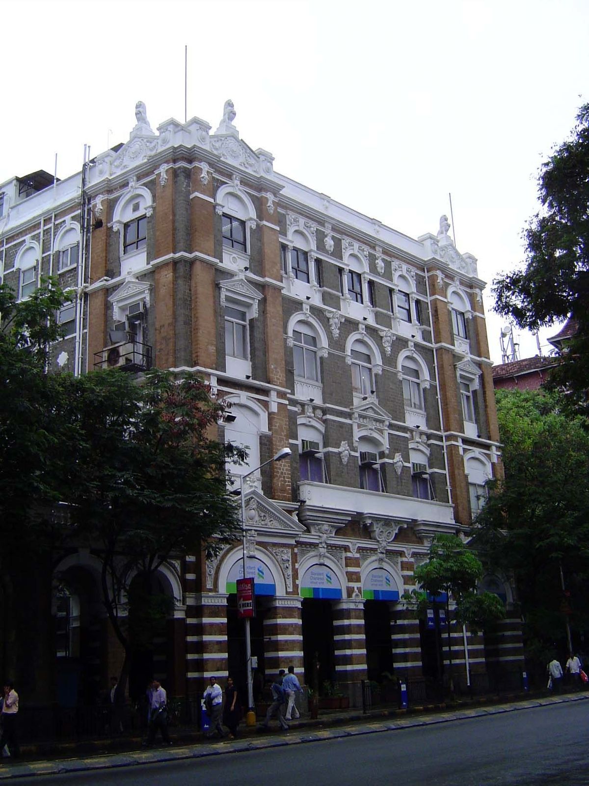 This is the Cox Building, with the pedestrian arcade that in 1896 became mandatory for buildings along Hornby Naoroji Road.