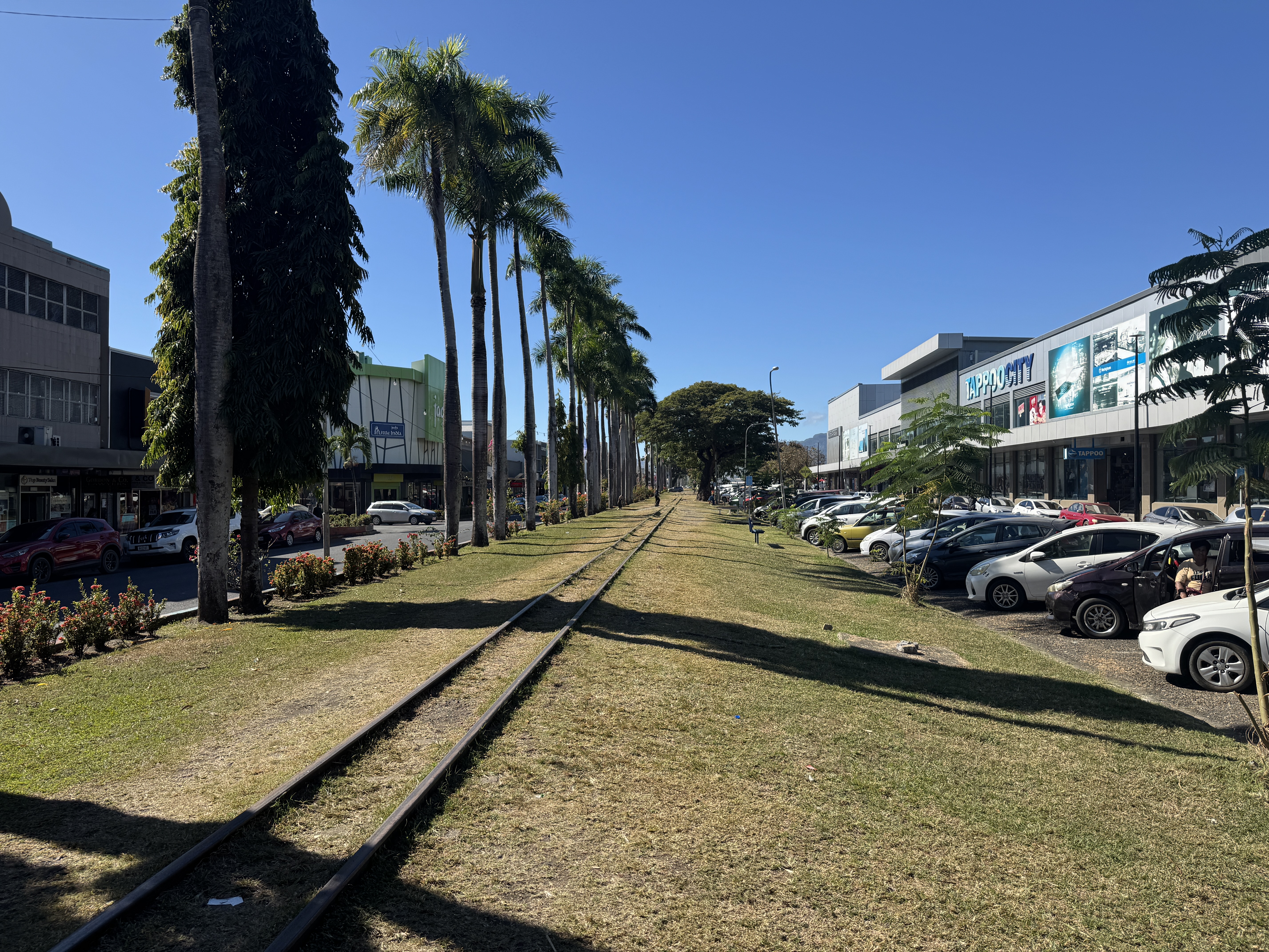 A cane-train track runs down the median of Narara Parade.
