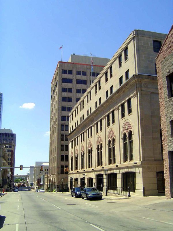 The middle building—the one with the handsomely arched windows—was originally the Elks Lodge. It was supposed to be 12 stories tall, but mon