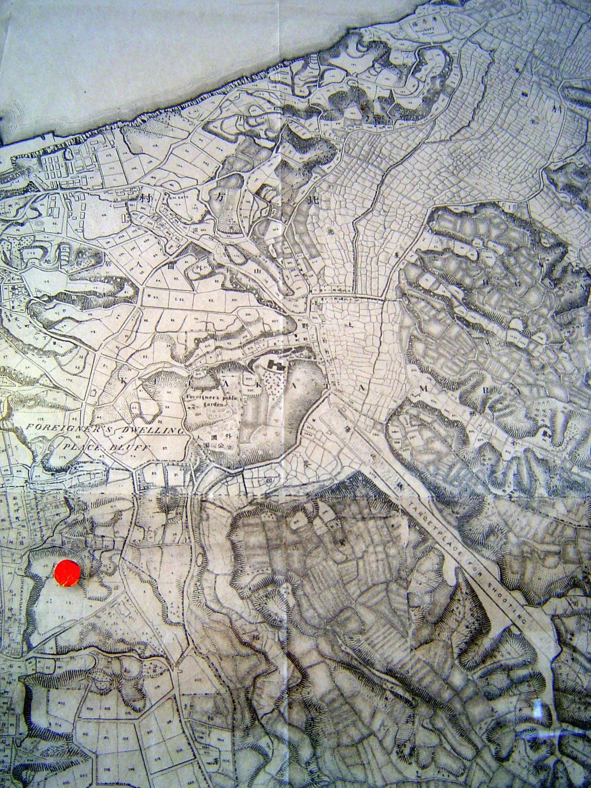 The east side of the Bluff is shown descending to valleys filled with rice paddies—and a shooting range.