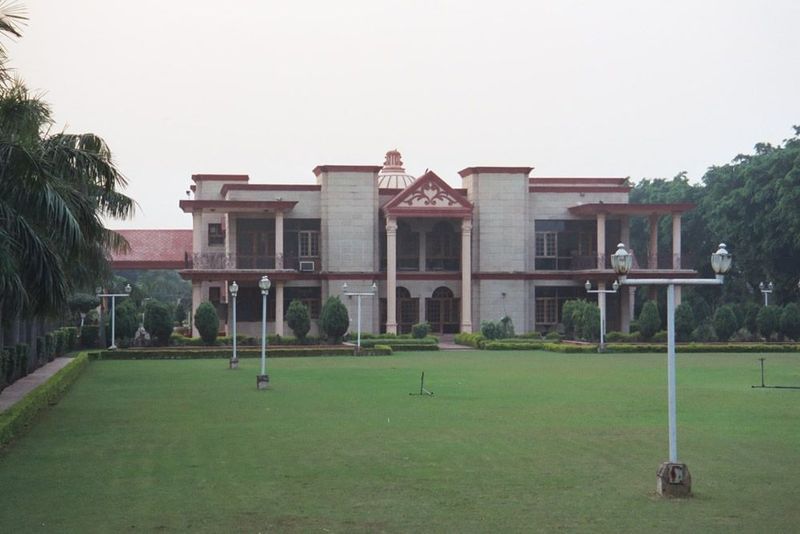 Behind the gate, a mansion paid for by sales of school books published by the Mohan Book Depot. The architecture isn't quite up to the vicer