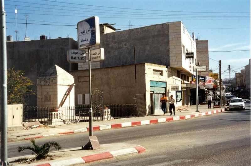 The sign reads "Haifa Street," but beyond it there's a squat obelisk with—of all things—an airplane propeller. Any ideas?