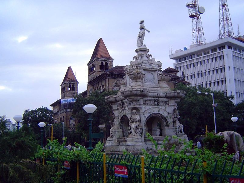 The fountain in context, with the broodingly dark post office in the background.