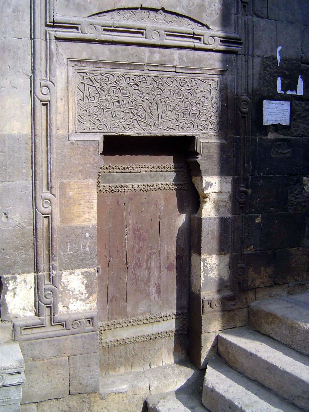 Doors once at street level are now several steps below.