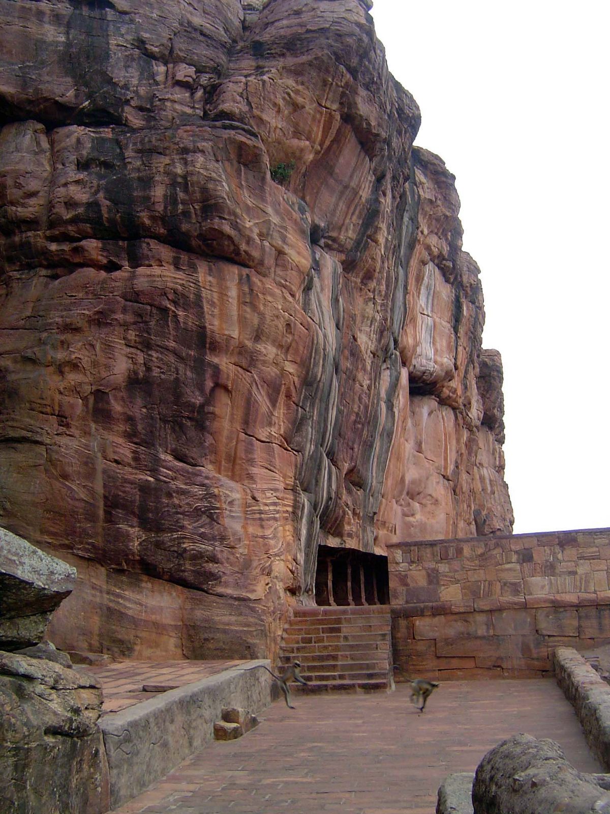 The cave seen from the east. Monkeys gambol.