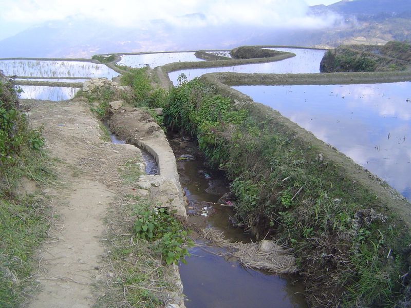 We'll get there by following the main irrigation channel. The concrete is all new, built sometime after 2010. Like the trash, it doesn't fit